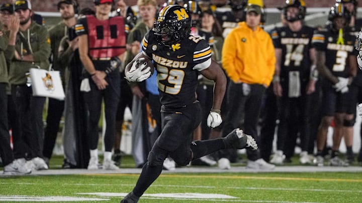 Nov 15, 2025; Columbia, Missouri, USA; Missouri Tigers running back Ahmad Hardy (29) runs the ball against the Mississippi State Bulldogs during the second half of the game at Faurot Field at Memorial Stadium. Mandatory Credit: Denny Medley-Imagn Images
