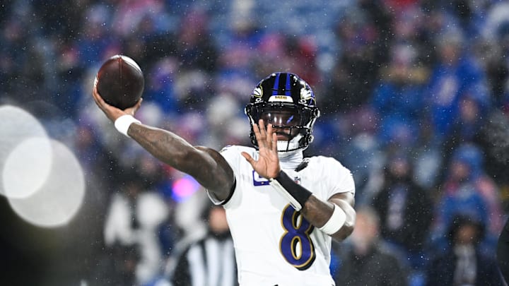 Jan 19, 2025; Orchard Park, New York, USA; Baltimore Ravens quarterback Lamar Jackson (8) throws the ball during warm ups before the game against the Buffalo Bills in a 2025 AFC divisional round game at Highmark Stadium. Mandatory Credit: Mark Konezny-Imagn Images