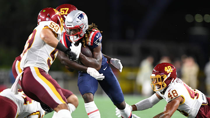 Aug 12, 2021; Foxborough, Massachusetts, USA; New England Patriots receiver Kristian Wilkerson (17) runs against Washington Football Team defensive end Bunmi Rotimi (57), inside linebacker Jordan Kunaszyk (59), and saftey Darrick Forrest (48) during the second half at Gillette Stadium. Mandatory Credit: Brian Fluharty-Imagn Images