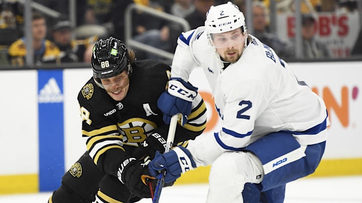 Apr 20, 2024; Boston, Massachusetts, USA; Boston Bruins right wing David Pastrnak (88) and Toronto defenseman Simon Benoit (2)