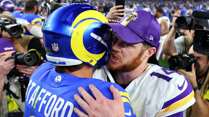 Jan 13, 2025; Glendale, AZ, USA; Minnesota Vikings quarterback Sam Darnold (14) and Los Angeles Rams quarterback Matthew Stafford (9) hug after the NFC wild card game at State Farm Stadium. Mandatory Credit: Mark J. Rebilas-Imagn Images Jan 13, 2025; Glendale, AZ, USA; Minnesota Vikings quarterback Sam Darnold (14) and Los Angeles Rams quarterback Matthew Stafford (9) hug after the NFC wild card game at State Farm Stadium. Mandatory Credit: Mark J. Rebilas-Imagn Images