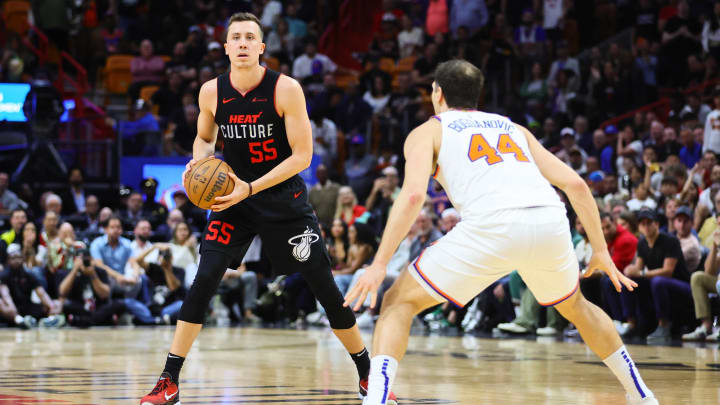 Apr 2, 2024; Miami, Florida, USA; Miami Heat forward Duncan Robinson (55) controls the basketball; Credit: Sam Navarro-USA TODAY Sports