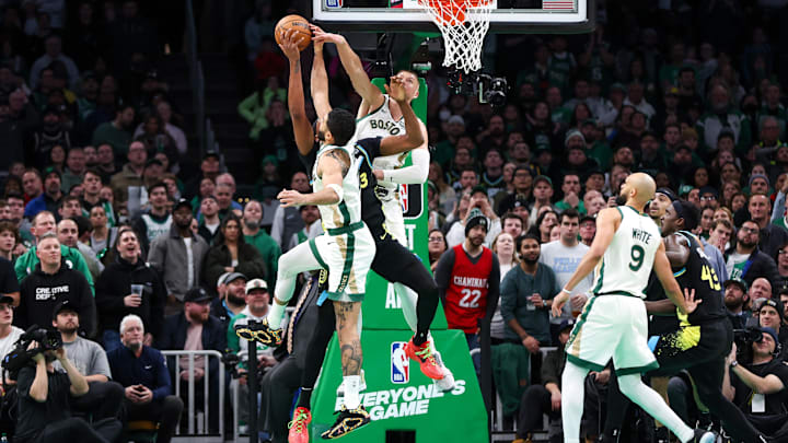 Jan 30, 2024; Boston, Massachusetts, USA: Boston Celtics forward Jayson Tatum (0) and Boston Celtics center Kristaps Porzingis (8) block Indiana Pacers center Myles Turner (33) during the second half at TD Garden. Mandatory Credit: Paul Rutherford-Imagn Images