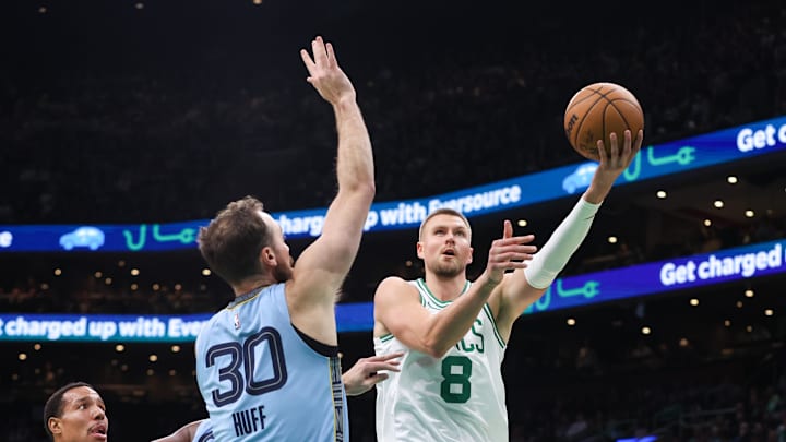 Dec 7, 2024; Boston, Massachusetts, USA; Boston Celtics center Kristaps Porzingis (8) shoots during the first half against the Memphis Grizzlies at TD Garden. Mandatory Credit: Paul Rutherford-Imagn Images