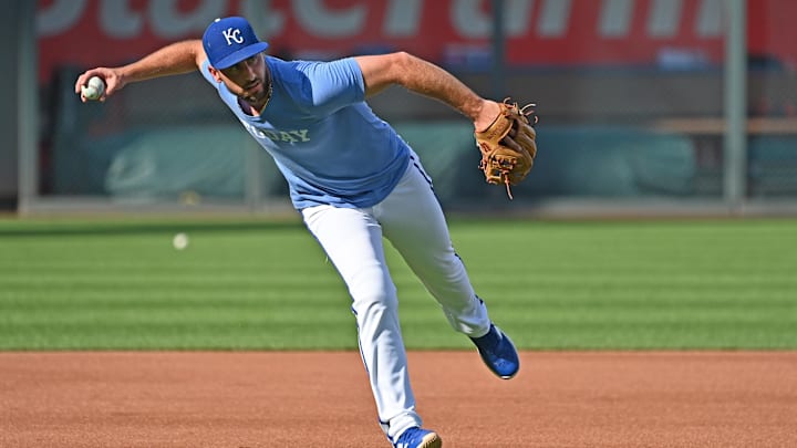Sep 18, 2024; Kansas City, Missouri, USA; Kansas City Royals third baseman Paul DeJong (15) takes fielding practice before a game against the Detroit Tigers at Kauffman Stadium. Sep 18, 2024; Kansas City, Missouri, USA; Kansas City Royals third baseman Paul DeJong (15) takes fielding practice before a game against the Detroit Tigers at Kauffman Stadium.