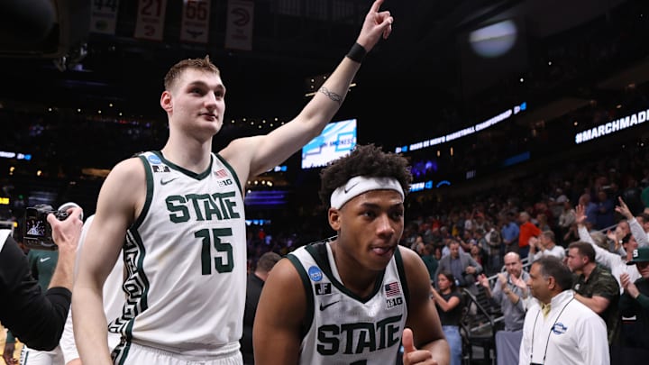 Mar 28, 2025; Atlanta, GA, USA; Michigan State Spartans center Carson Cooper (15) and guard Jeremy Fears Jr. (1) celebrate after defeating the Mississippi Rebels in a South Regional semifinal of the 2025 NCAA tournament at State Farm Arena. Mandatory Credit: Brett Davis-Imagn Images