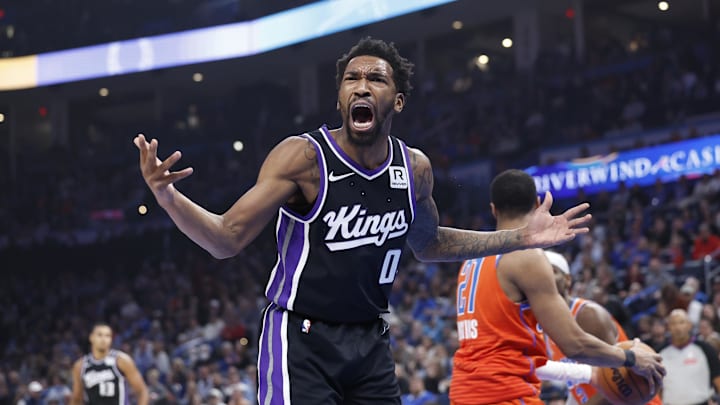 Feb 1, 2025; Oklahoma City, Oklahoma, USA; Sacramento Kings guard Malik Monk (0) reacts after a play against the Oklahoma City Thunder during the first quarter at Paycom Center. Mandatory Credit: Alonzo Adams-Imagn Images Feb 1, 2025; Oklahoma City, Oklahoma, USA; Sacramento Kings guard Malik Monk (0) reacts after a play against the Oklahoma City Thunder during the first quarter at Paycom Center. Mandatory Credit: Alonzo Adams-Imagn Images