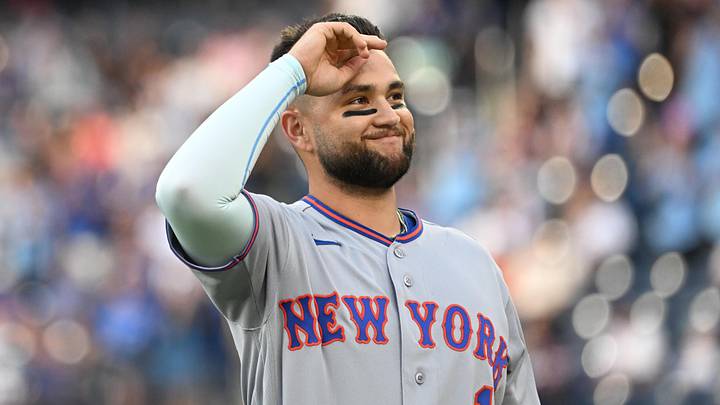 New York Mets third baseman Bo Bichette acknowledges fans' applause after watching a video tribute.