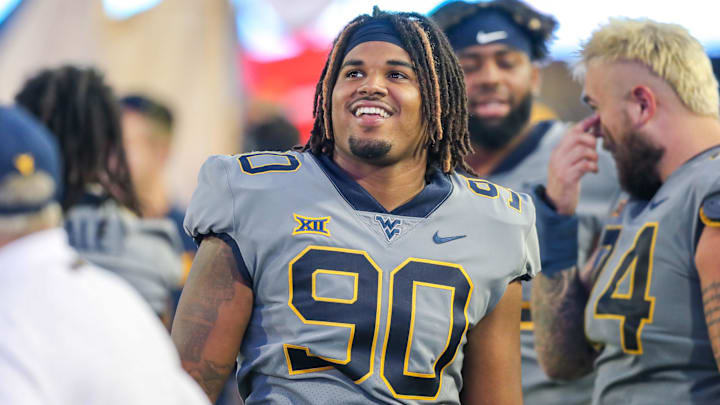 Sep 11, 2021; Morgantown, West Virginia, USA; West Virginia Mountaineers defensive lineman Akheem Mesidor (90) walks along the sidelines during the third quarter against the Long Island Sharks at Mountaineer Field at Milan Puskar Stadium. Mandatory Credit: Ben Queen-Imagn Images
