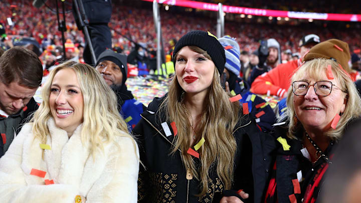 Recording artist Taylor Swift (center) Brittany Mahomes (left) and Donna Kelce (right) react after the AFC Championship game against the Buffalo Bills at GEHA Field at Arrowhead Stadium.