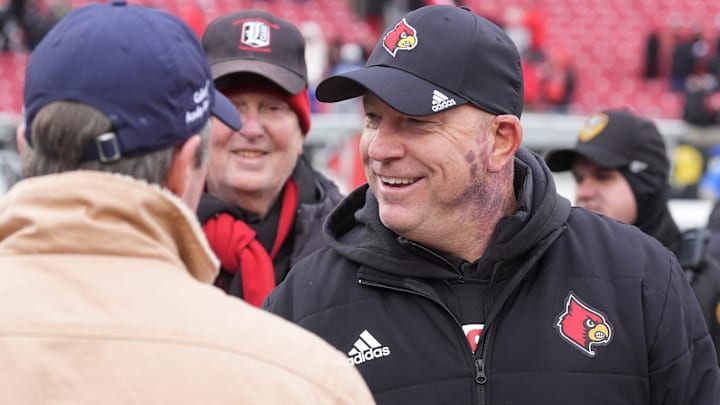Louisville’s coach Jeff Brohm shook hands with Governor Andy Beshear after winning the Governor’s Cup.