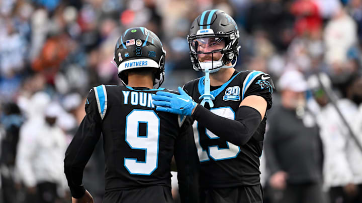Nov 24, 2024; Charlotte, North Carolina, USA; Carolina Panthers quarterback Bryce Young (9) with wide receiver Adam Thielen (19) on the field in the fourth quarter at Bank of America Stadium. Mandatory Credit: Bob Donnan-Imagn Images