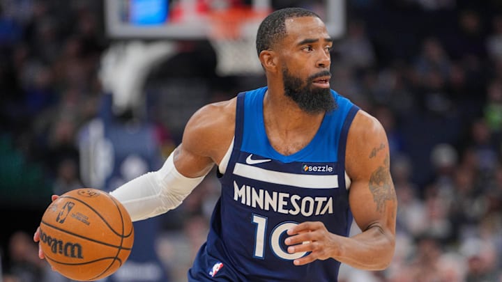 Minnesota Timberwolves guard Mike Conley dribbles against the Philadelphia 76ers in the second quarter at Target Center in Minneapolis on March 4, 2025. 