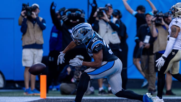 Nov 3, 2024; Charlotte, North Carolina, USA; Carolina Panthers running back Chuba Hubbard (30) spikes the ball after scoring against the New Orleans Saints during the fourth quarter at Bank of America Stadium. Mandatory Credit: Scott Kinser-Imagn Images Nov 3, 2024; Charlotte, North Carolina, USA; Carolina Panthers running back Chuba Hubbard (30) spikes the ball after scoring against the New Orleans Saints during the fourth quarter at Bank of America Stadium. Mandatory Credit: Scott Kinser-Imagn Images