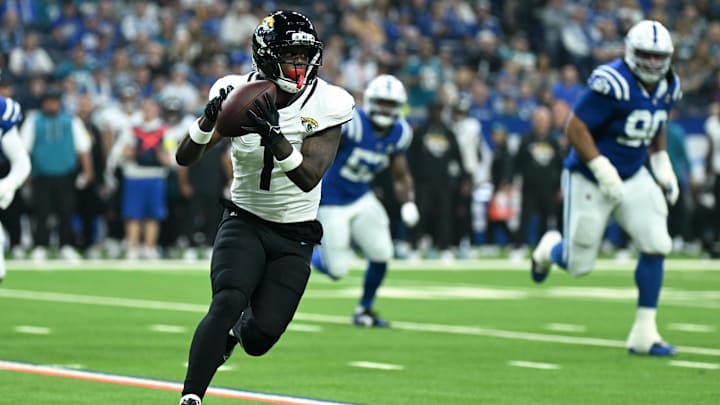 Dec 28, 2025; Indianapolis, Indiana, USA; Jacksonville Jaguars running back Travis Etienne Jr. (1) runs during the first half against the Indianapolis Colts at Lucas Oil Stadium. Mandatory Credit: Robert Goddin-Imagn Images