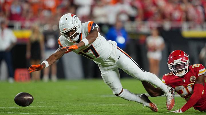 Sep 14, 2026; Kansas City, Missouri, USA;  Denver Broncos wide receiver Jaylen Waddle (17) attempts to make a catch against the Kansas City Chiefs at GEHA Field at Arrowhead Stadium.  Mandatory Credit: Jay Biggerstaff-Imagn Images