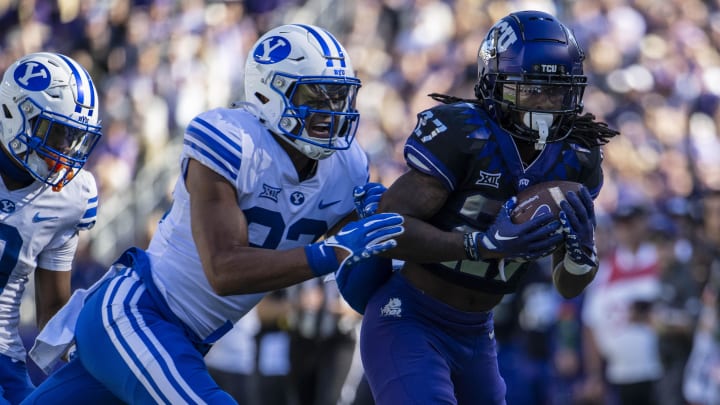 Oct 14, 2023; Fort Worth, Texas, USA; TCU Horned Frogs wide receiver Jordyn Bailey (27) catches a pass for a first down as Brigham Young Cougars safety Raider Damuni (33) defends during the game at Amon G. Carter Stadium. Mandatory Credit: Jerome Miron-USA TODAY Sports