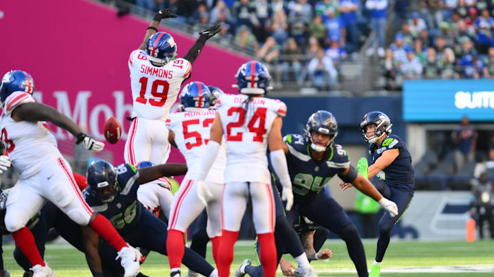Oct 6, 2024; Seattle, Washington, USA; New York Giants linebacker Isaiah Simmons (19) blocks a field goal kick attempt by Seattle Seahawks place kicker Jason Myers (5) during the second half at Lumen Field. Oct 6, 2024; Seattle, Washington, USA; New York Giants linebacker Isaiah Simmons (19) blocks a field goal kick attempt by Seattle Seahawks place kicker Jason Myers (5) during the second half at Lumen Field.