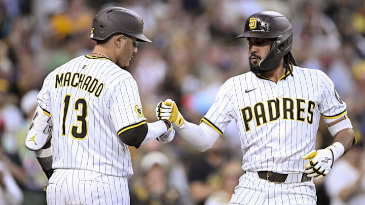 Sep 10, 2025; San Diego, California, USA; San Diego Padres right fielder Fernando Tatis Jr. (23) is congratulated by third baseman Manny Machado (13) after hitting a solo home run during the fifth inning against the Cincinnati Reds at Petco Park. Mandatory Credit: Denis Poroy-Imagn Images Sep 10, 2025; San Diego, California, USA; San Diego Padres right fielder Fernando Tatis Jr. (23) is congratulated by third baseman Manny Machado (13) after hitting a solo home run during the fifth inning against the Cincinnati Reds at Petco Park. Mandatory Credit: Denis Poroy-Imagn Images