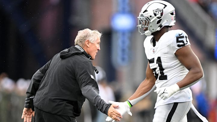 Sep 7, 2025; Foxborough, Massachusetts, USA; Las Vegas Raiders head coach Pete Carroll  reacts with defensive end Malcolm Koonce (51) during the second half at Gillette Stadium. Mandatory Credit: Brian Fluharty-Imagn Images