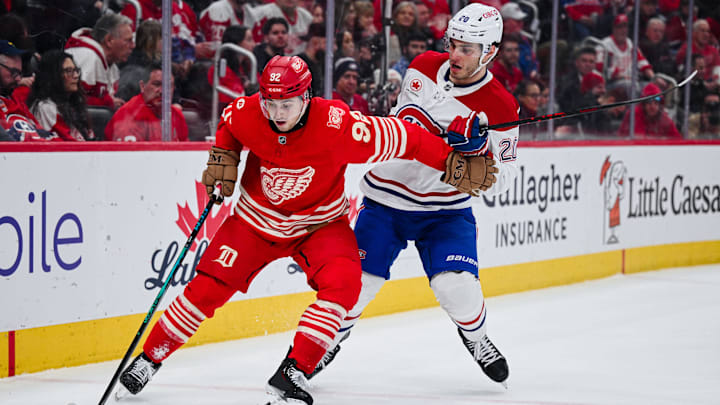 Mar 19, 2026; Detroit, Michigan, USA; Detroit Red Wings center Marco Kasper (92) and Montreal Canadiens left wing Juraj Slafkovsky (20) battle for the puck during the second period at Little Caesars Arena. Mandatory Credit: Tim Fuller-Imagn Images