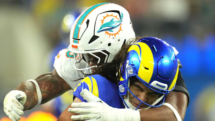 Los Angeles Rams wide receiver Puka Nacua (17) is tackled by Miami Dolphins linebacker Quinton Bell (56) in the second half at SoFi Stadium. Los Angeles Rams wide receiver Puka Nacua (17) is tackled by Miami Dolphins linebacker Quinton Bell (56) in the second half at SoFi Stadium.