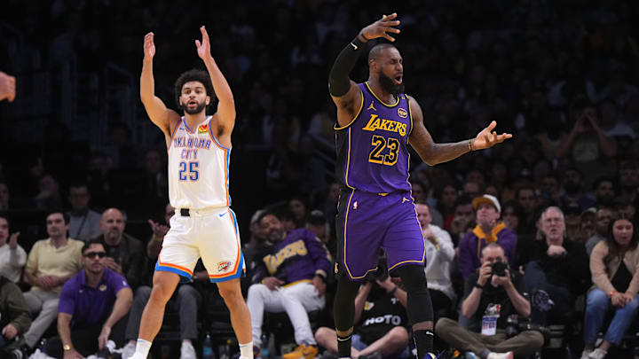 Nov 29, 2024; Los Angeles, California, USA; Los Angeles Lakers forward LeBron James (23) and Oklahoma City Thunder guard Ajay Mitchell (25) react in the second half at Crypto.com Arena. Mandatory Credit: Kirby Lee-Imagn Images
