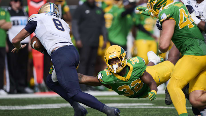 Aug 30, 2025; Eugene, Oregon, USA; Oregon Ducks linebacker Nasir Wyatt (32) leaps for a tackle during the second half against Montana State Bobcats quarterback Justin Lamson (8) at Autzen Stadium. Mandatory Credit: Troy Wayrynen-Imagn Images