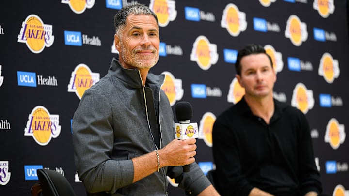 Sep 25, 2025; El Segundo, CA, USA; Los Angeles Lakers general manager Rob Pelinka, left, speaks during a press conference to preview the 2025-26 season at UCLA Health Training Center. Mandatory Credit: William Liang-Imagn Images