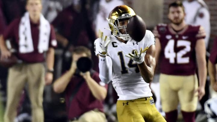 Sep 5, 2021; Tallahassee, Florida, USA; Notre Dame Fighting Irish saftey Kyle Hamilton (14) intercepts a pass past Florida State Seminoles running back Jashaun Corbin (0) during the second quarter at Doak S. Campbell Stadium.