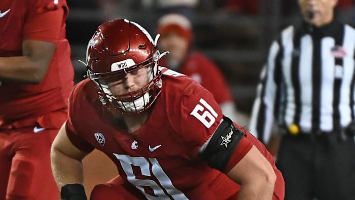 Nov 26, 2022; Pullman, Washington, USA; Washington State Cougars offensive lineman Christian Hilborn (61) lines up for a play against the Washington Huskies in the first half at Gesa Field at Martin Stadium. Mandatory Credit: James Snook-Imagn Images