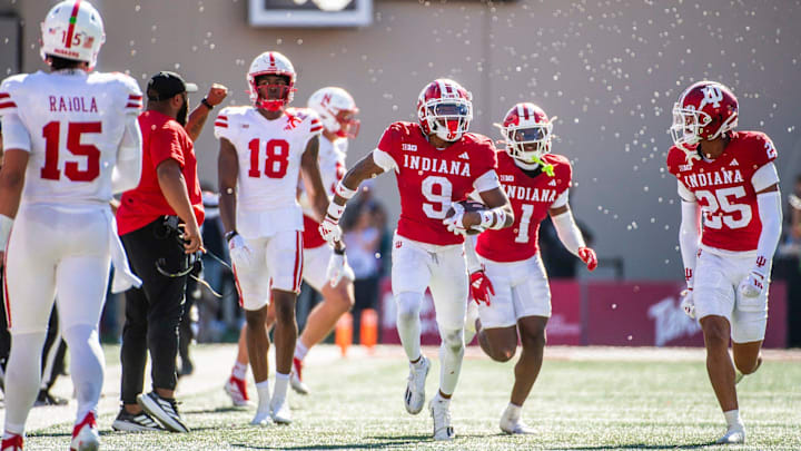 Indiana cornerback Jamier Johnson (9) celebrates his interception of Nebraska quarterback Dylan Raiola (15) on Saturday at Memorial Stadium.