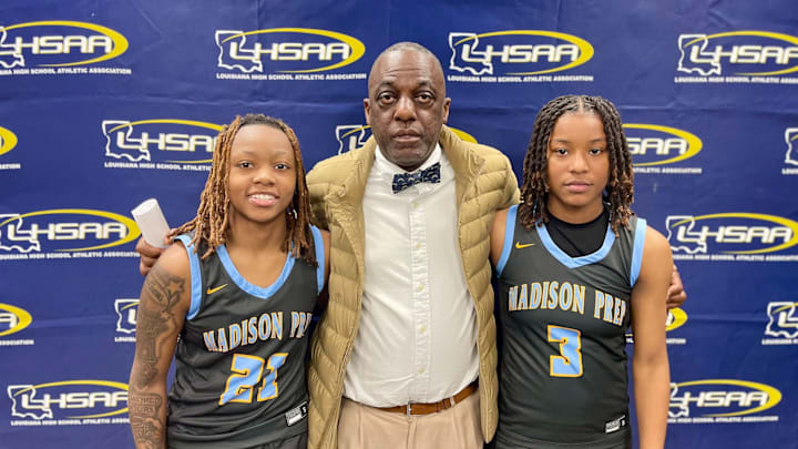 No. 5 Madison Prep coach Dwayne Hayes flanked by Auri Ray (left) and Brooklyn Smith (right) after the Chargers knocked off No. 1 University in the Division II select semifinals.