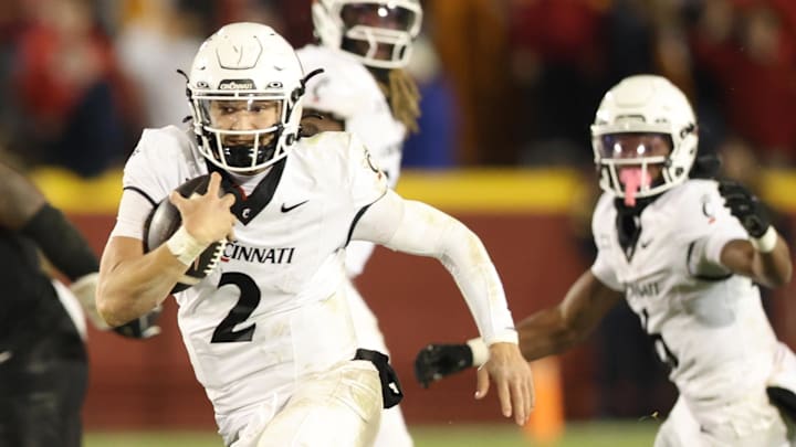 Nov 16, 2024; Ames, Iowa, USA; Cincinnati Bearcats quarterback Brendan Sorsby (2) runs for a touchdown against the Iowa State Cyclones at Jack Trice Stadium. The Iowa State Cyclones won the game 34-17. Mandatory Credit: Reese Strickland-Imagn Images Nov 16, 2024; Ames, Iowa, USA; Cincinnati Bearcats quarterback Brendan Sorsby (2) runs for a touchdown against the Iowa State Cyclones at Jack Trice Stadium. The Iowa State Cyclones won the game 34-17. Mandatory Credit: Reese Strickland-Imagn Images