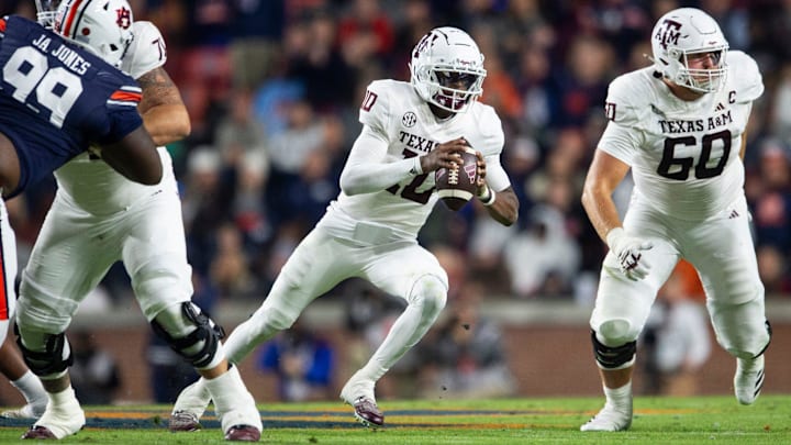 Texas A&M Aggies quarterback Marcel Reed (10) runs the ball as Auburn Tigers take on Texas A&M Aggies at Jordan-Hare Stadium in Auburn, Ala., on Saturday, Nov. 23, 2024. Auburn Tigers lead Texas A&M Aggies 21-7 at halftime.