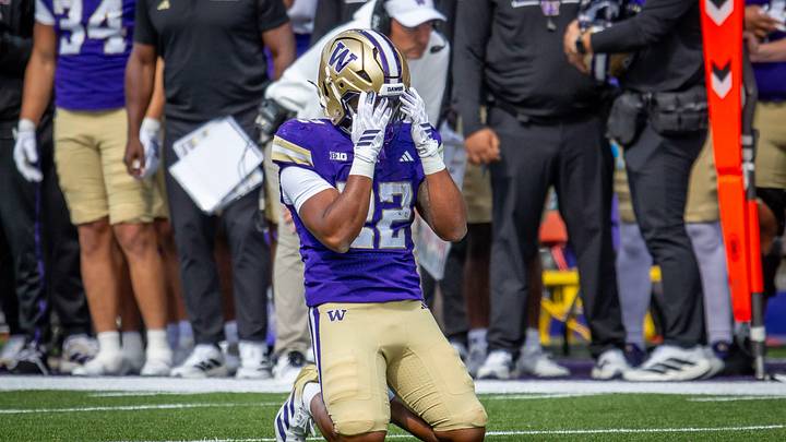 Trey Cooley agonizes after dropping a wide-open, fourth-down pass, with Jedd Fisch equally distraught on the UW sideline. Trey Cooley agonizes after dropping a wide-open, fourth-down pass, with Jedd Fisch equally distraught on the UW sideline.