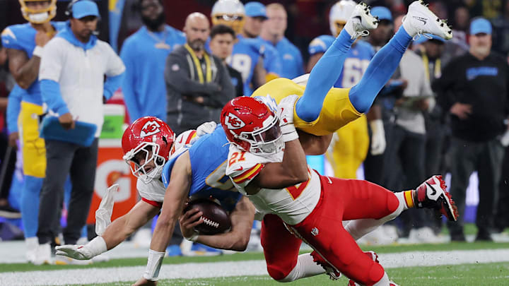 [US, Mexico & Canada customers only] Sep 5, 2025; Sao Paulo, BRAZIL; Kansas City Chiefs safety Jaden Hicks (21) and linebacker Drue Tranquill (23) in action with Los Angeles Chargers quarterback Justin Herbert (10) in the first half during a NFL game at Corinthians Arena. Mandatory Credit: Amanda Perobelli/Reuters via Imagn Images