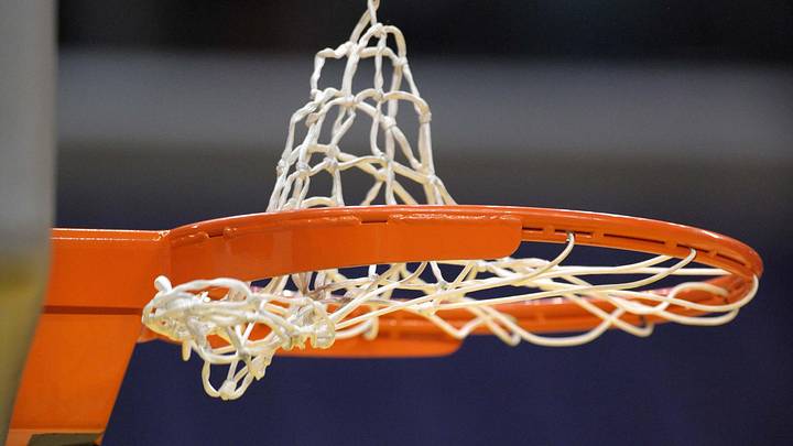 Aug 16, 2011; Los Angeles CA, USA; General view of a WNBA basketball going through the rim and the net before the game between the Atlanta Dream and the Los Angeles Sparks. Mandatory Credit: Kirby Lee/Image of Sport-Imagn Images