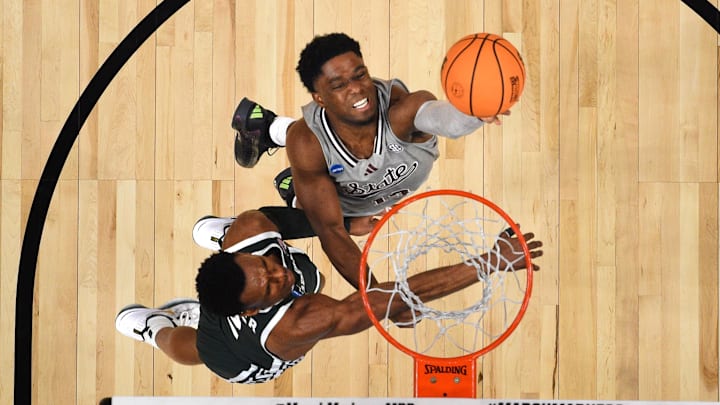 Mar 21, 2024; Charlotte, NC, USA; Mississippi State Bulldogs guard Josh Hubbard (13) shoots as Michigan State Spartans guard Tyson Walker (2) defends at Spectrum Center. Mandatory Credit: Bob Donnan-Imagn Images