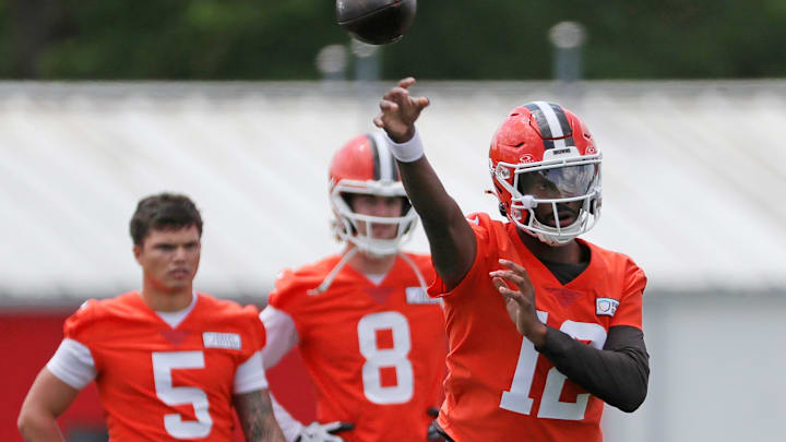 Browns quarterback Shedeur Sanders throws as QBs Dillon Gabriel (5) and Kenny Pickett look on during minicamp, Tuesday, June 10, 2025, in Berea.