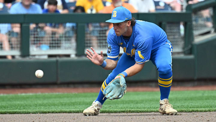 Jun 14, 2025; Omaha, Neb, USA;  UCLA Bruins shortstop Roch Cholowsky (1) fields a ground ball against the Murray State Racers during the ninth inning at Charles Schwab Field. Mandatory Credit: Steven Branscombe-Imagn Images