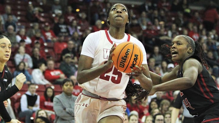 Wisconsin's Serah Williams goes to the basket as Rutgers' Chyna Cornwell defends on at the Kohl Center in Madison, Wisconsin on Saturday January, 27, 2024.