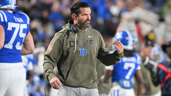 Nov 15, 2025; Durham, North Carolina, USA; Duke Blue Devils head coach Manny Diaz reacts during the third quarter against the Virginia Cavaliers at Wallace Wade Stadium. Mandatory Credit: Zachary Taft-Imagn Images Nov 15, 2025; Durham, North Carolina, USA; Duke Blue Devils head coach Manny Diaz reacts during the third quarter against the Virginia Cavaliers at Wallace Wade Stadium. Mandatory Credit: Zachary Taft-Imagn Images