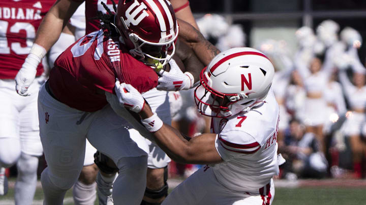 Oct 19, 2024; Bloomington, Indiana, USA; Indiana running back Justice Ellison is tackled by Nebraska defensive back Malcolm Hartzog Jr. at the end of a long third-down run during the first quarter.