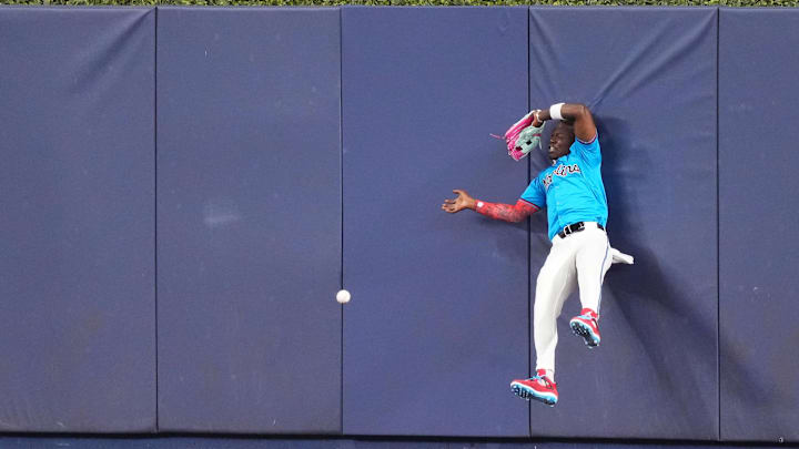 Apr 3, 2024; Miami, Florida, USA; Miami Marlins center fielder Jazz Chisholm Jr. (2) attempts but