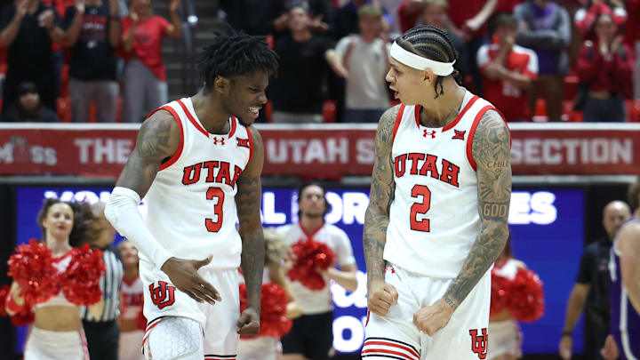 Utah Utes guard Don McHenry (left) reacts to making a 3-point basket with guard Terrence Brown (right) that tied the game with five seconds left in the game against the Weber State Wildcats at Jon M. Huntsman Center. Utah Utes guard Don McHenry (left) reacts to making a 3-point basket with guard Terrence Brown (right) that tied the game with five seconds left in the game against the Weber State Wildcats at Jon M. Huntsman Center.