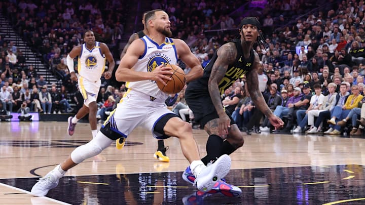  Golden State Warriors guard Stephen Curry (30) goes to the basket against Utah Jazz guard Jordan Clarkson (00) during the first quarter at Delta Center. Mandatory Credit: Rob Gray-Imagn Images