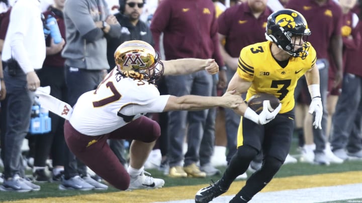 Iowa's Cooper DeJean makes the play against Minnesota.