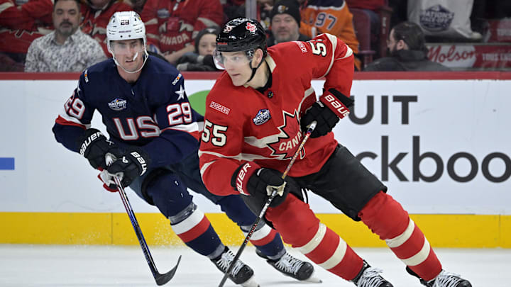 Feb 15, 2025; Montreal, Quebec, CAN; [Imagn Images direct customers only] Team Canada defenseman Colton Parayko (55) plays the puck and Team United States forward Brock Nelson (29) defends in the third period during a 4 Nations Face-Off ice hockey game at the Bell Centre. Mandatory Credit: Eric Bolte-Imagn Images