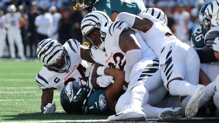 Oct 27, 2024; Cincinnati, Ohio, USA;  Cincinnati Bengals safety Vonn Bell (24) and defensive tackle B.J. Hill (92) tackle Philadelphia Eagles quarterback Jalen Hurts (1) during the second quarter at Paycor Stadium. Mandatory Credit: Joseph Maiorana-Imagn Images